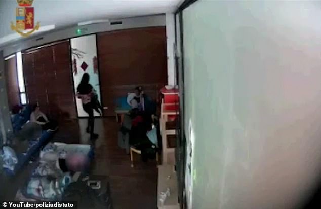 One teacher is caught swinging a child in the air as she carries him in a classroom in Italy. Two Chinese kindergarten teachers in Tuscany have been arrested on suspicion of child abuse