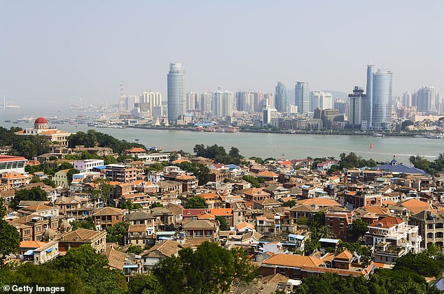 The couple reportedly live in the city of Xiamen (pictured) in south-eastern China