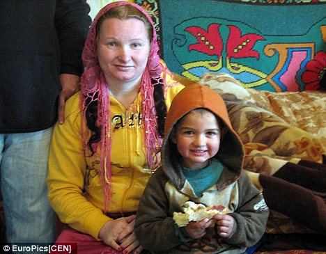 Happy family: Rifca Stanescu, left, now 25, gave birth to daughter maria aged just 12. Maria then bore Ion, now two, right, at the age of 11