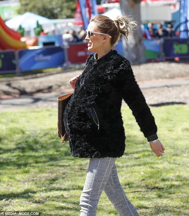 Pregnancy style: Bec had her brown locks tied up into a messy bun and covered her face with statement sunglasses