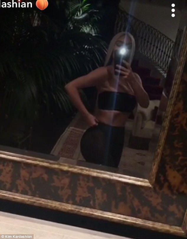 Flawless: Kim took to Snapchat after the ceremony, giving her followers a glimpse at her backside in the curve hugging bottoms