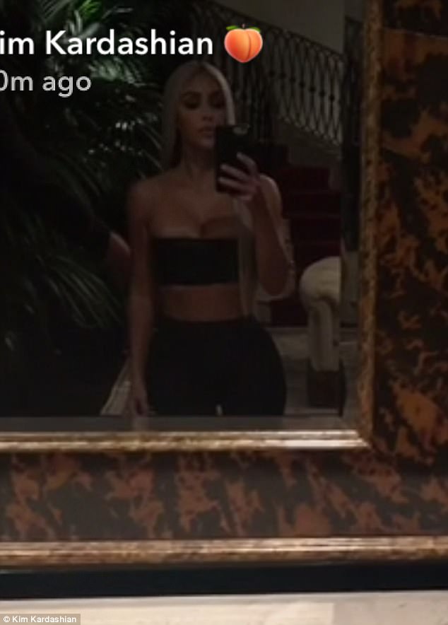 And another one: She posed in front of a mirror for a selfie before changing into another look